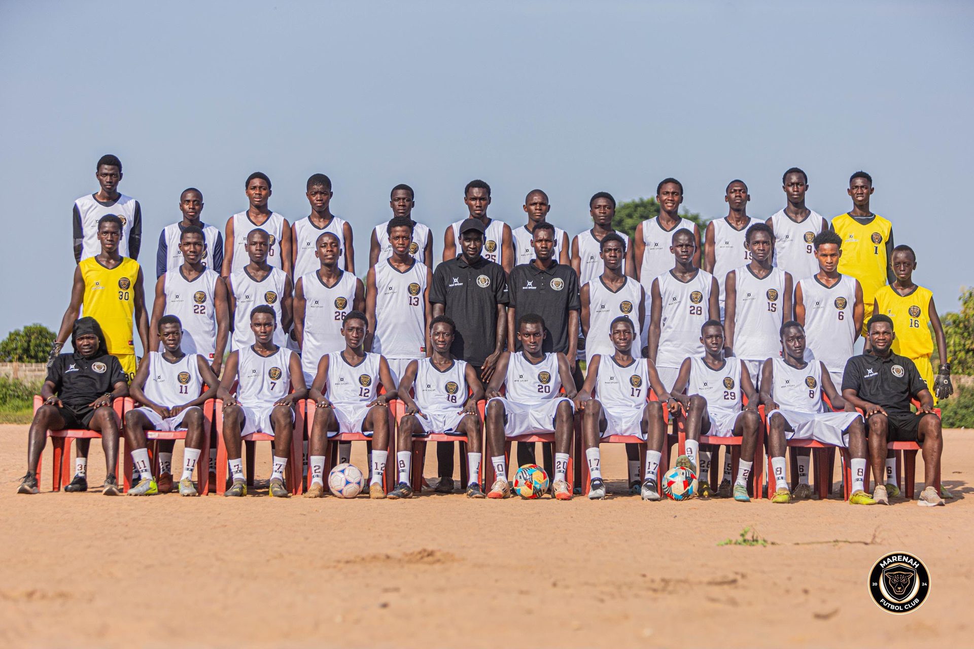 Marenah FC youth soccer team gathered in white kits